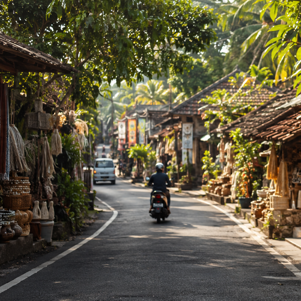 Street scene with shops selling wooden and woven goods under a tree.